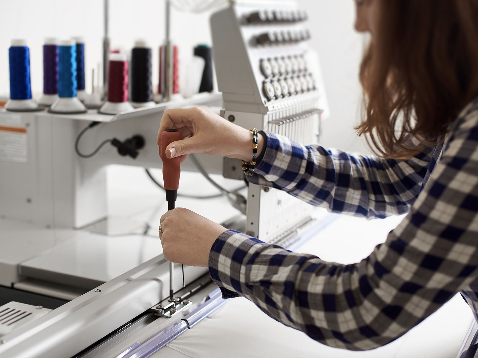ThreadCo Print Shop production — screen printing and embroidery