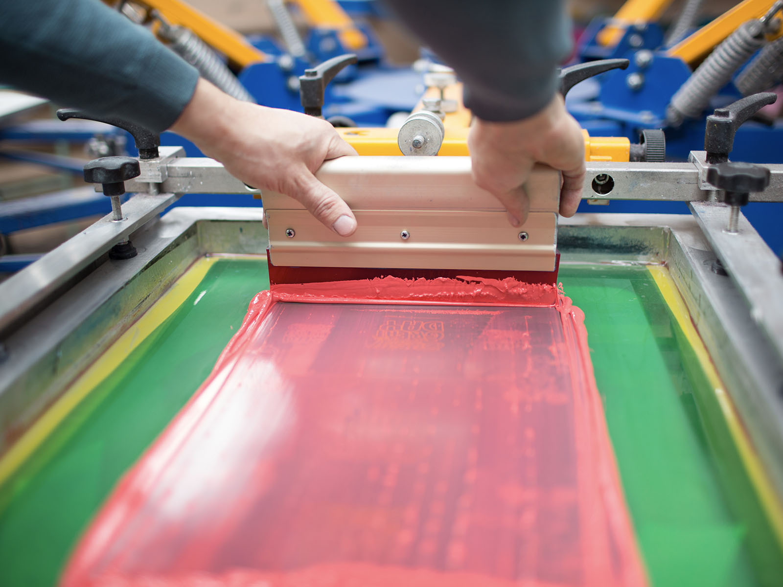 ThreadCo Print Shop production — screen printing and embroidery
