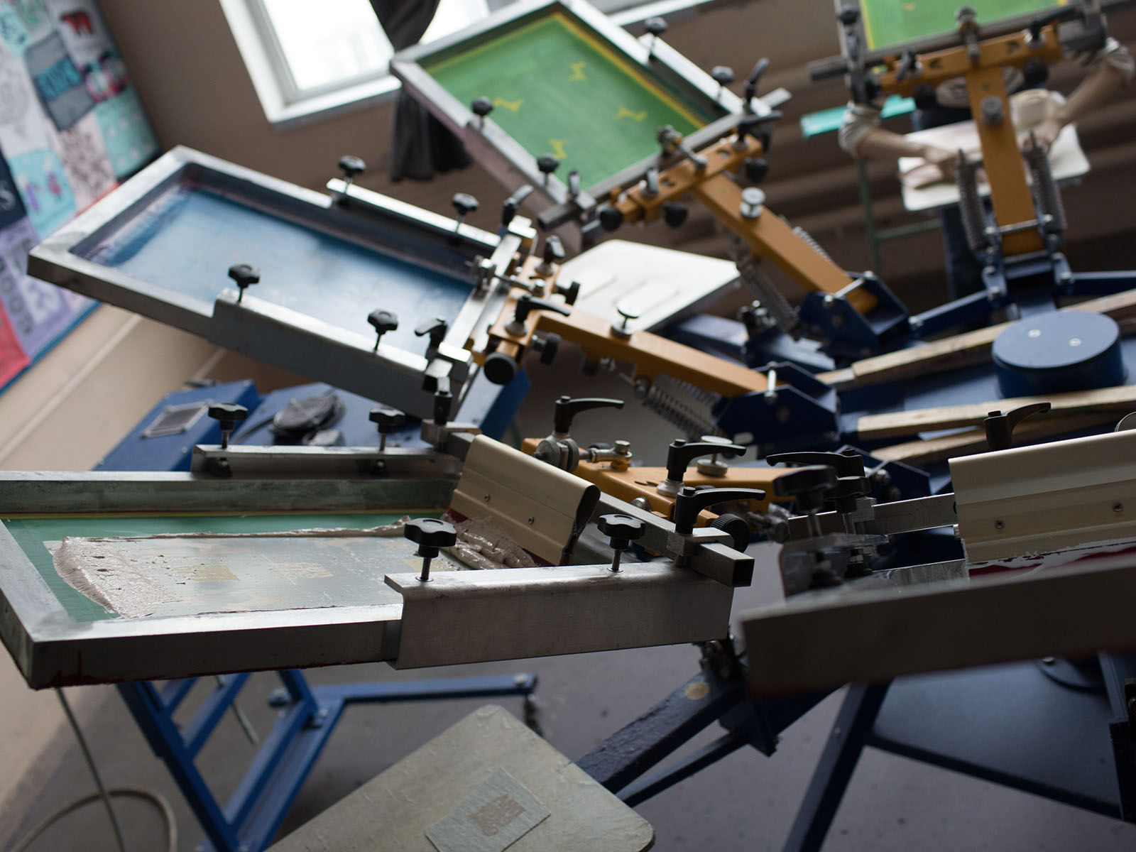 ThreadCo Print Shop production — screen printing and embroidery